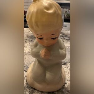 This is a vintage porcelain figure.